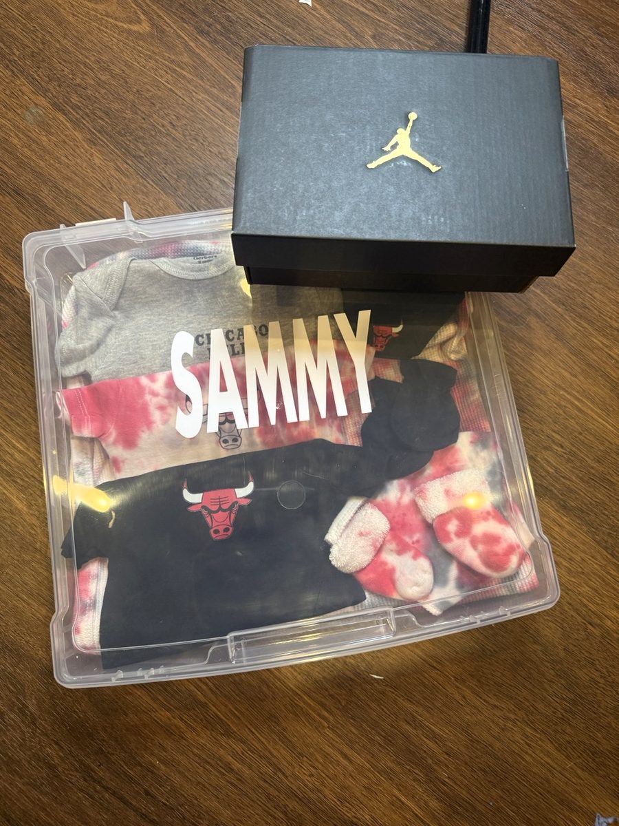 Custom baby box with a name, onesies, and sneakers