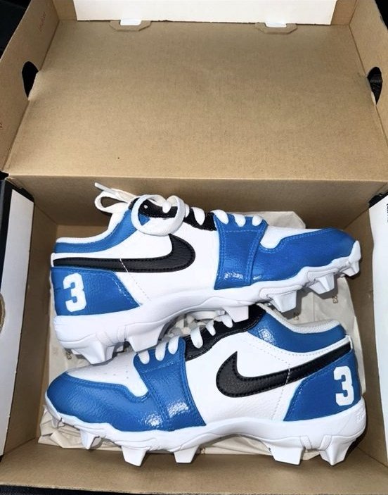 Custom blue football cleats with a number