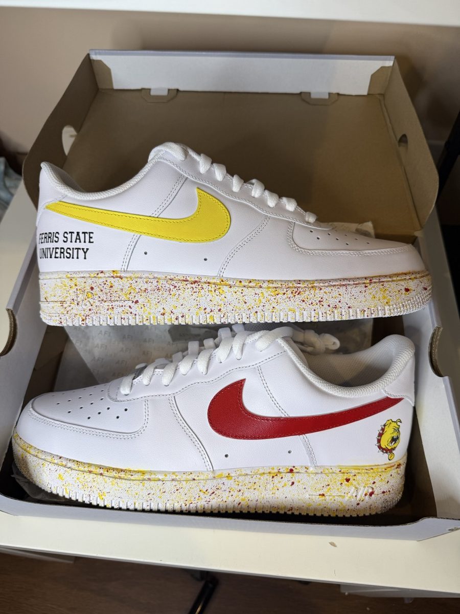Red and gold college sneakers with a splatter sole