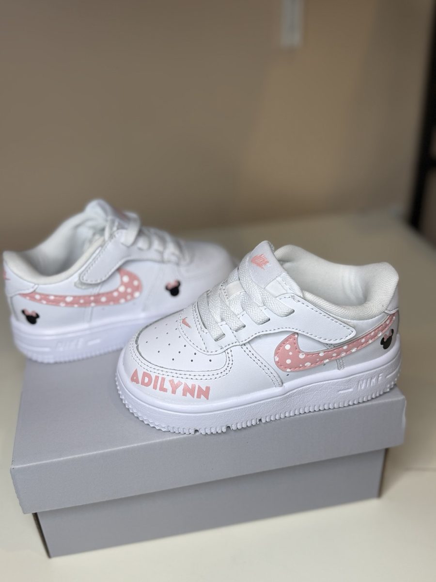 Pink polka dot kids sneakers with a name