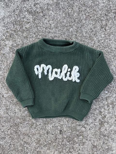 Hand-stitched “Malik” name sweater