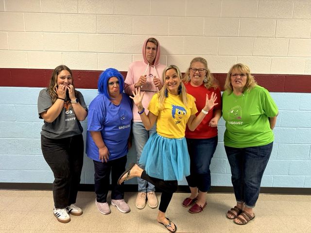 Group in matching Halloween costume shirts